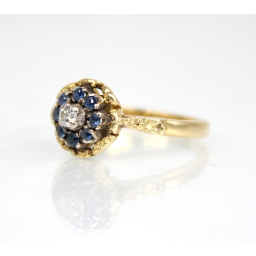 73 - A sapphire and diamond floral cluster ring, the central round brilliant cut diamond weighing approxi... 