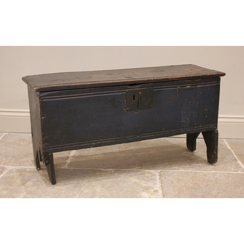 731 - An early 18th century painted oak six plank coffer, the hinged cover with a channelled front edge op... 