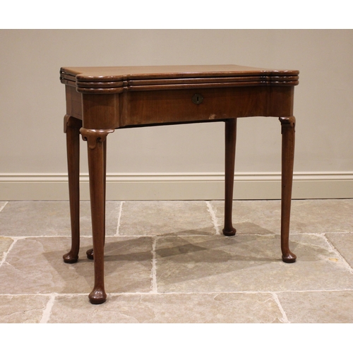 733 - A George II mahogany triple fold over combination games and card table, the rectangular folding top ... 