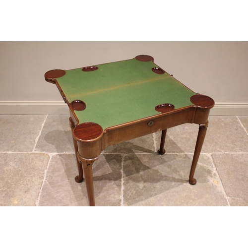 733 - A George II mahogany triple fold over combination games and card table, the rectangular folding top ... 