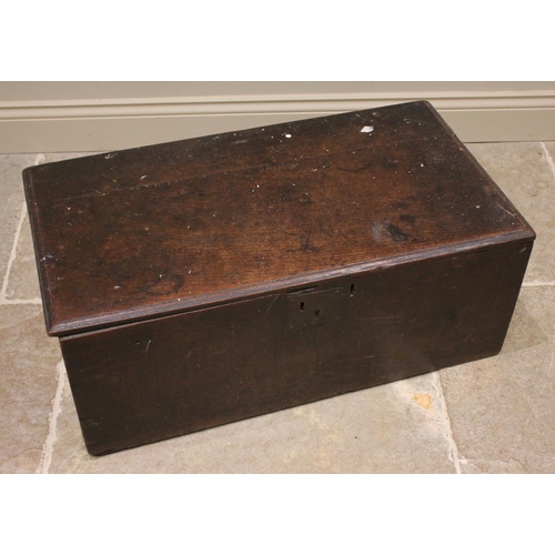 736 - A 17th century oak table top coffer/carriage box of plain rectangular proportions with hinged cover ... 