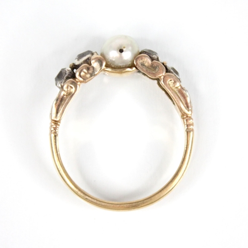 74 - A Victorian and later pearl and diamond ring, the central pearl measuring 5.7mm x 5.5mm, with two ol... 