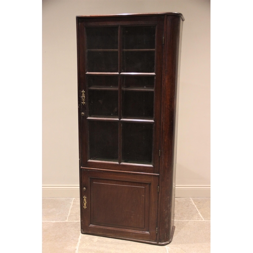 744 - A 19th century mahogany freestanding bookcase, rounded to the right hand side, the single glazed doo... 