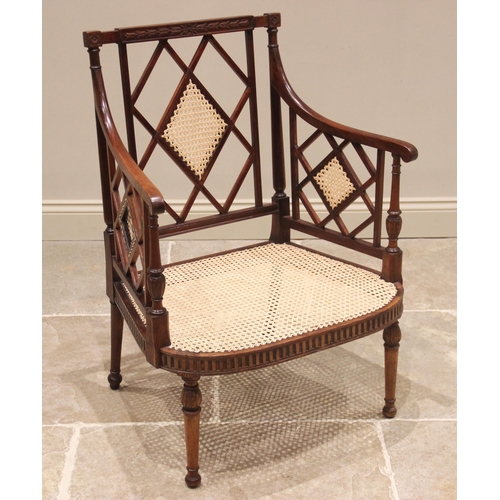 746 - A Regency mahogany open work armchair, the lattice work back panel and sides enclosing the wide bow ... 