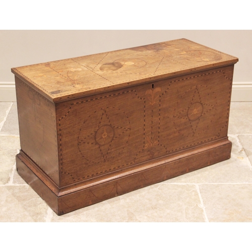 747 - A George III mahogany and inlaid marriage chest, the rectangular hinged top inlaid with a central st... 