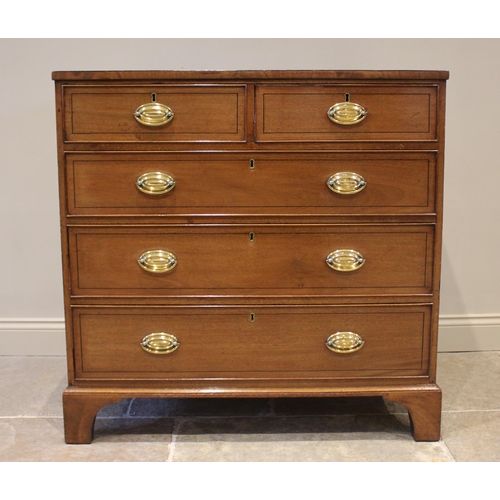 749 - A late Regency mahogany chest of drawers, the rectangular top above an arrangement of two short and ... 