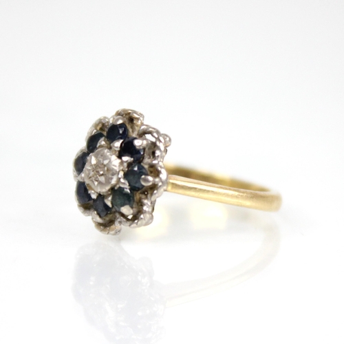 75 - An early 20th century sapphire and diamond floral cluster ring, the central single cut diamond set t... 