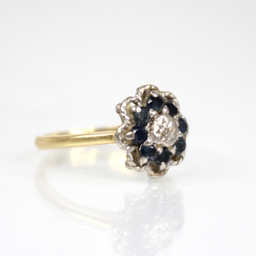 75 - An early 20th century sapphire and diamond floral cluster ring, the central single cut diamond set t... 