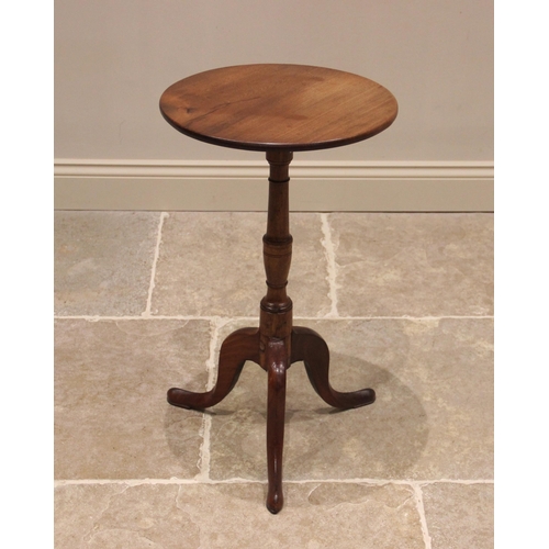 752 - A George III mahogany tripod table, the circular top upon a ring turned baluster column extending to... 