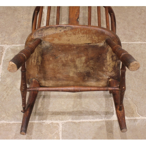 760 - A late 18th/early 19th century primitive ash and elm comb back Windsor chair, probably Thames Valley... 