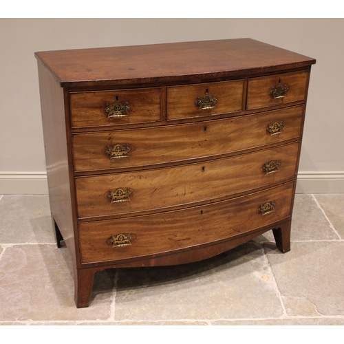 765 - An early 19th century mahogany bowfront chest of drawers, formed from three short and three long gra... 