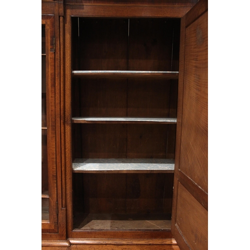 771 - A George III oak, mahogany and rosewood crossbanded housekeepers cupboard, the upper section of brea... 