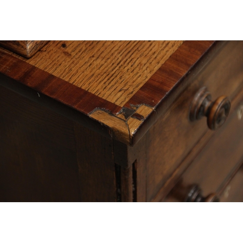 771 - A George III oak, mahogany and rosewood crossbanded housekeepers cupboard, the upper section of brea... 