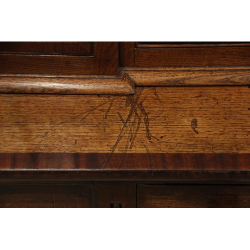 771 - A George III oak, mahogany and rosewood crossbanded housekeepers cupboard, the upper section of brea... 