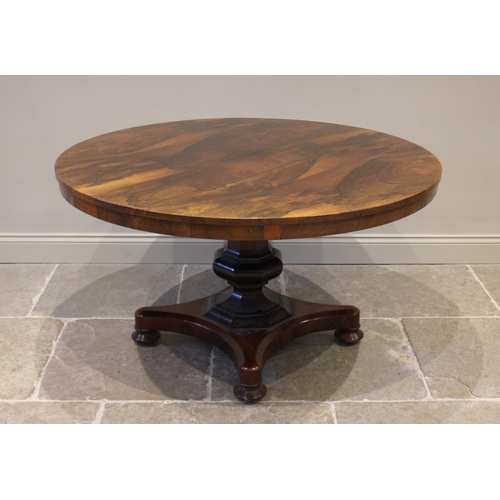 778 - A William IV rosewood breakfast table, the circular tilt top raised upon an octagonal column termina... 