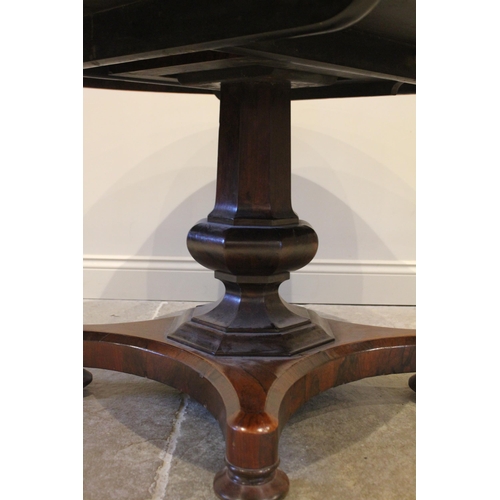 778 - A William IV rosewood breakfast table, the circular tilt top raised upon an octagonal column termina... 