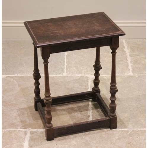 784 - A 19th century oak joint stool, the rectangular moulded top raised upon slender ring turned, baluste... 