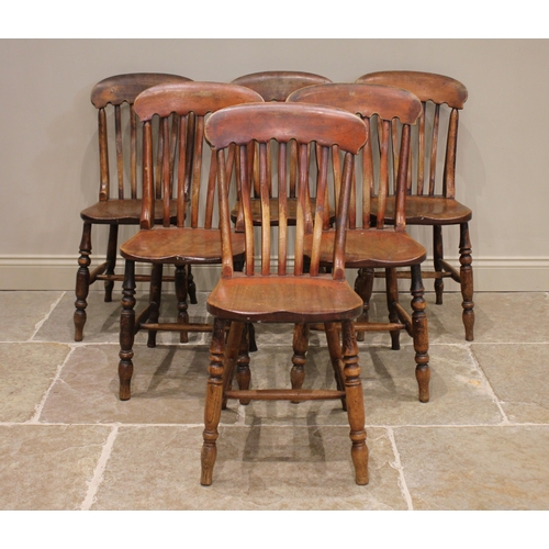 818 - A well matched set of six Victorian elm and ash kitchen chairs, each with a serpentine lath back ove... 