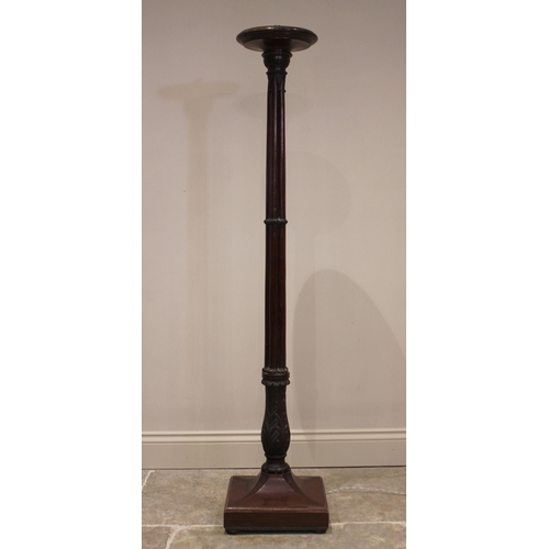 819 - A 19th century mahogany torchere/standard lamp, the circular rimmed top raised upon a cluster column... 