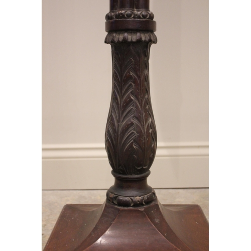 819 - A 19th century mahogany torchere/standard lamp, the circular rimmed top raised upon a cluster column... 