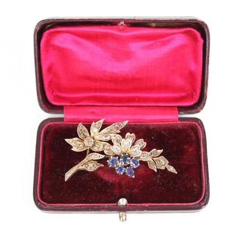 82 - A Victorian diamond and sapphire floral spray brooch, the floral head comprising five mixed cut sapp... 