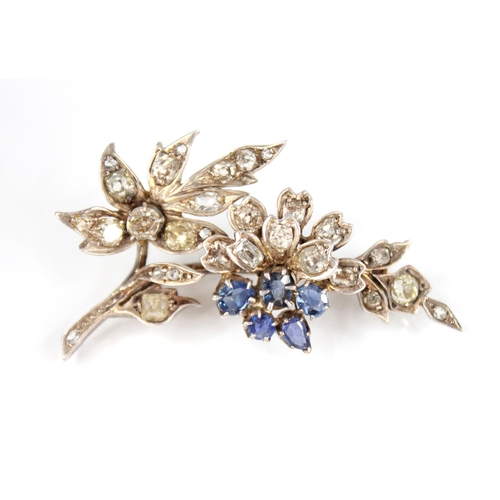 82 - A Victorian diamond and sapphire floral spray brooch, the floral head comprising five mixed cut sapp... 