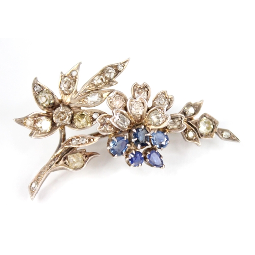 82 - A Victorian diamond and sapphire floral spray brooch, the floral head comprising five mixed cut sapp... 