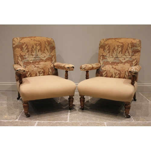 826 - A pair of Victorian lounge armchairs in the manner of Howard & Sons, partially covered in Liberty-es... 