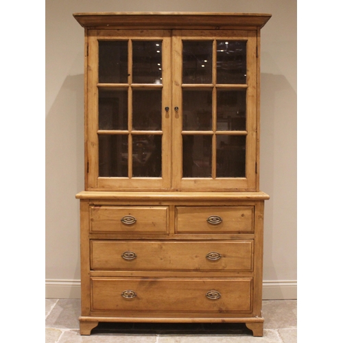 834 - A pine kitchen dresser with glazed top, 20th century, the upper section with shaped cornice above tw... 