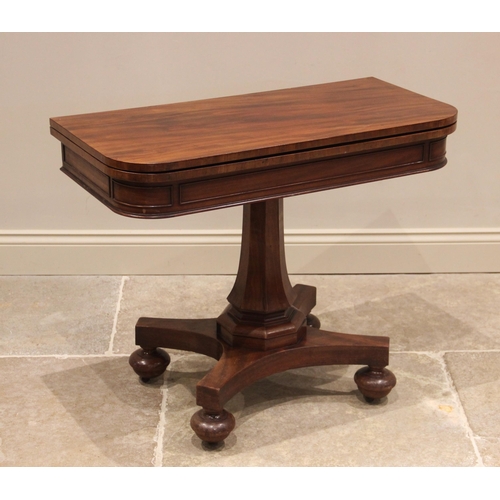 837 - A mahogany tea table, mid 19th century, the rounded rectangular folding top above a frieze applied w... 