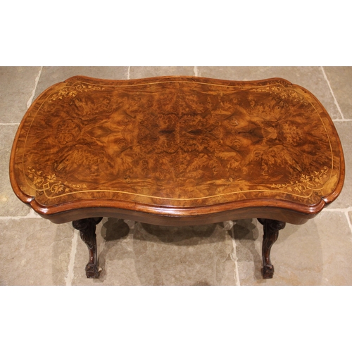 840 - A Victorian burr walnut serpentine card table, the quarter veneered moulded top inlaid with stringin... 