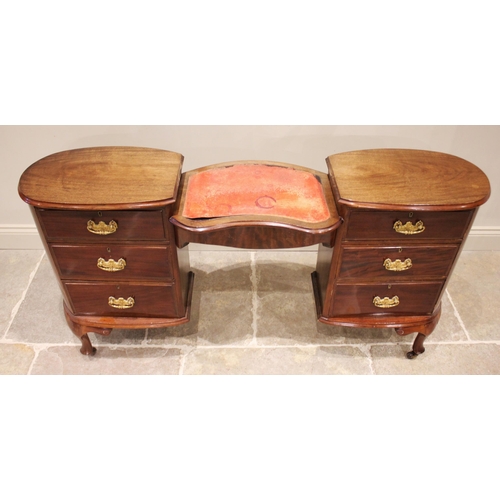 862 - An early 20th century mahogany dressing table/desk, the kidney shaped skiver inset desk top supporte... 