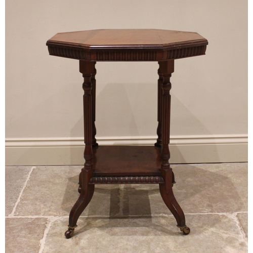 867 - An Edwardian mahogany octagonal top occasional library table, with gadrooned frieze and four fluted ... 