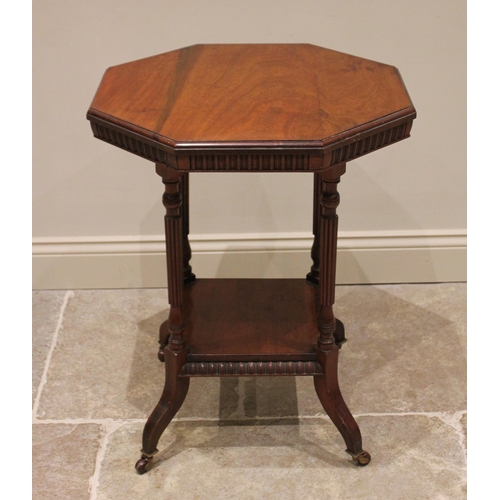 867 - An Edwardian mahogany octagonal top occasional library table, with gadrooned frieze and four fluted ... 