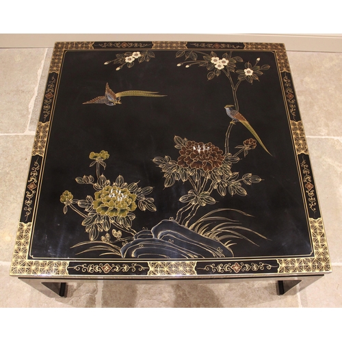 877 - A Japanese black lacquer coffee table, late 20th century, the table top detailed in gilt with exotic... 