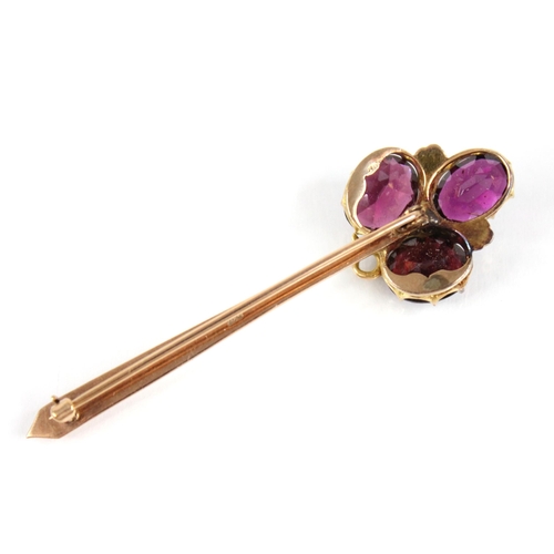 91 - A Victorian and later garnet and diamond brooch, comprising three oval mixed cut garnets, interspers... 