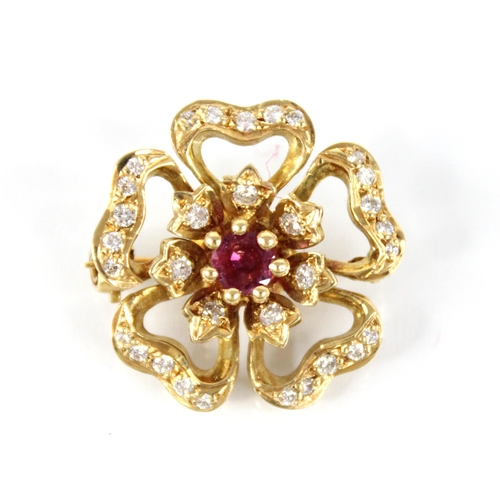 92 - A ruby and diamond 18ct gold floral brooch by Cropp & Farr, the central round mixed cut ruby measuri... 