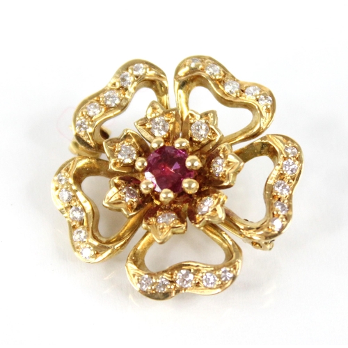 92 - A ruby and diamond 18ct gold floral brooch by Cropp & Farr, the central round mixed cut ruby measuri... 