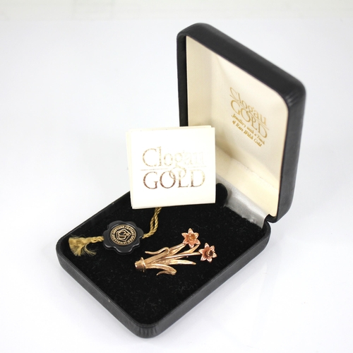 93 - A Clogau 9ct gold daffodil brooch, the daffodil heads modelled in rose gold, upon yellow gold stems ... 