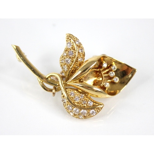 94 - An 18ct gold diamond set lily brooch, the plain polished shaped head with diamond set stamen (lackin... 