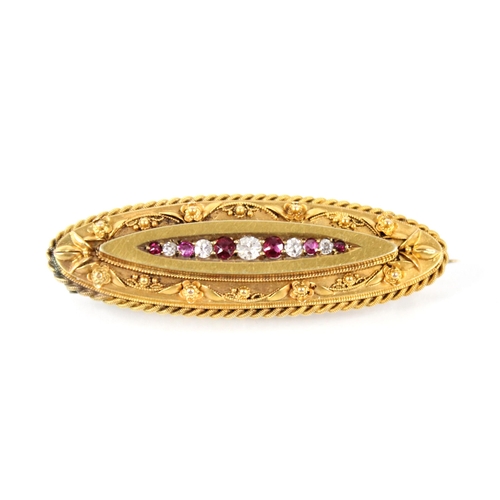 96 - A Victorian ruby and diamond Etruscan style brooch, the central panel set with graduated alternating... 