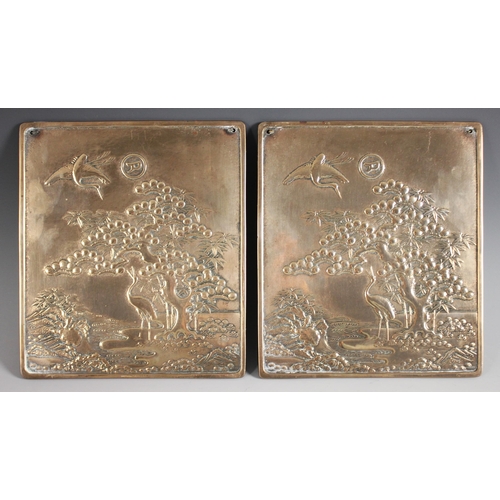 415 - A pair of Japanese polished bronze plaques, Meiji Period (1868-1912), each of rectangular form and d... 