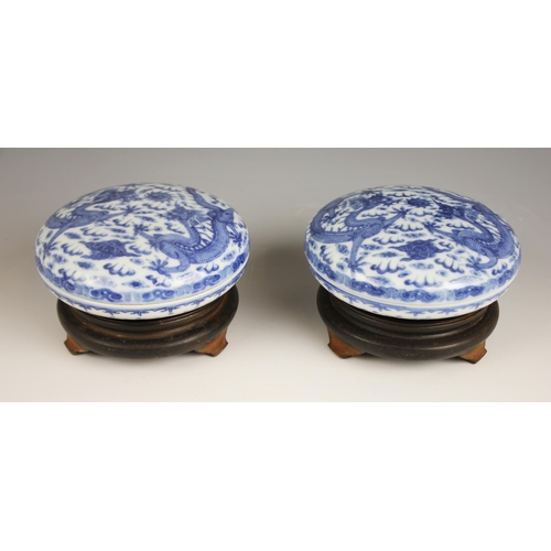 418 - A pair of Chinese porcelain blue and white boxes and covers, Qianlong seal mark, each circular box p... 