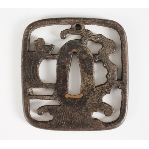 428 - A Japanese Tsuba, Edo Period (1603-1868), Kaku-gata, with pierced Ji designed as waves and a duck, 7... 