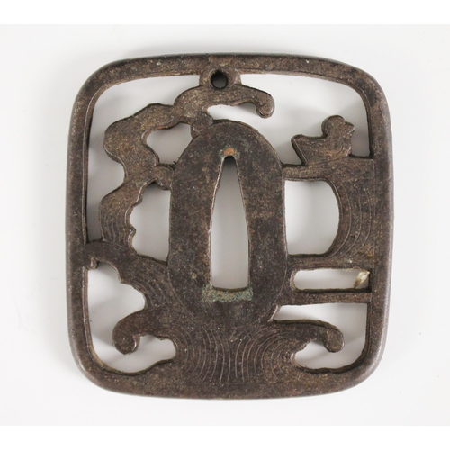 428 - A Japanese Tsuba, Edo Period (1603-1868), Kaku-gata, with pierced Ji designed as waves and a duck, 7... 