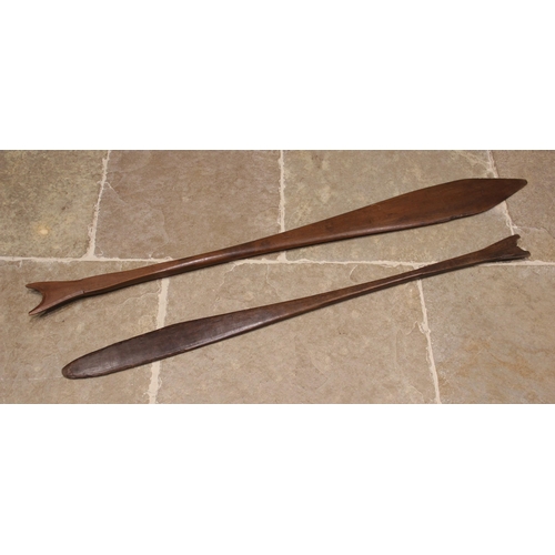 431 - Two large South America Suriname Maroon tribal art canoe paddles, 143cm and 165cm long (2)