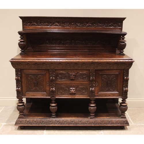 822 - A Victorian carved oak buffet, the superstructure back with carved foliate detail and inverted shelf... 