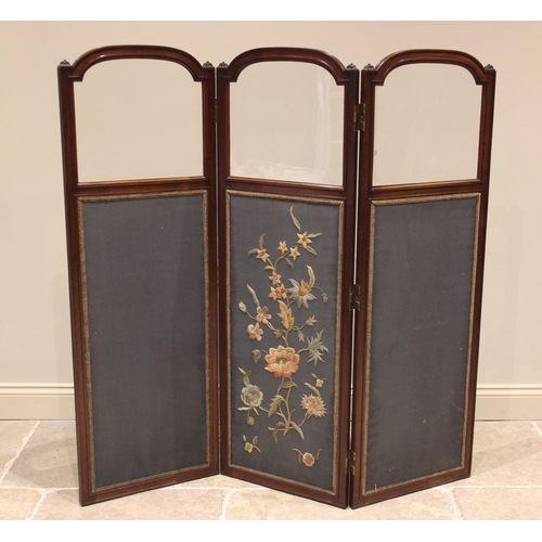 843 - A walnut framed silkwork three panel room screen, circa 1900, each of the three arched sections with... 