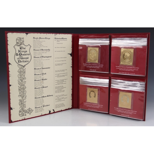 149 - An album of 23 carat gold with 12 carat white gold overlay faux stamps by Heirloom Investments, 