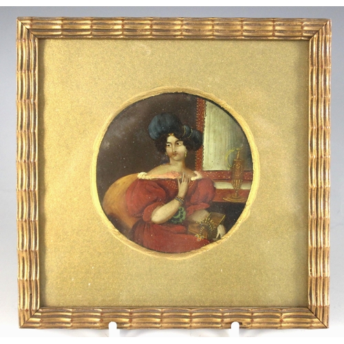 163 - Continental school (19th century),  
A tondo portrait miniature depicting a lady in blue hat holding... 